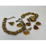 A collection of amber and costume jewellery including fobs, 2 necklaces, (one marked Jewelcraft),