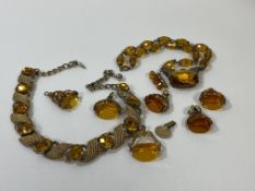 A collection of amber and costume jewellery including fobs, 2 necklaces, (one marked Jewelcraft),