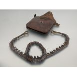 British Military hand coil chain saw with two handles and sharpening tool, in original leather case