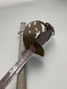 WWI German child's sword, pressed steel guard with eagle black handle, steel blade and scabbard (