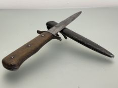 WWII 6.5" German boot knife, wooden grip on steel blade in black scabbard with sprung steel boot