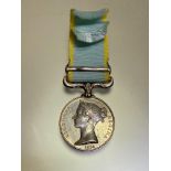 1854-56 British Crimea medal with a Sebastopol clasp. Naming erased, suspender re-affixed