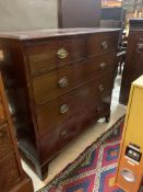 A George III mahogany chest, the moulded top over three long graduated cock beaded drawers, raised