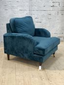 A contemporary easy chair, the back and seat cushion and frame upholstered in teal crushed velvet,