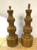 A pair of 1970's Doulton Staffs's table lamps with olive green glaze, (63cm to top of lampholder)
