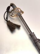 A Victorian pattern brass hilted Officer's sword, the brass hilt with cast VR cypher, sharkskin