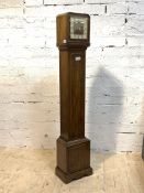 An early 20th century walnut cased westminster chiming longcase clock, the dial inscribed Hamilton