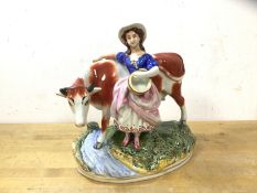 A Staffordshire figure, Milk Maid with Cow crossing stream, (21cm high)