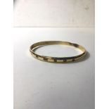 A bangle, Edinburgh, marked 375, makers marks SMS (7.5cm diameter) weighs 24.21 grammes