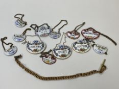 A collection of china and enamel bottle labels and a gilt metal Albert chain (27cm) (a lot)