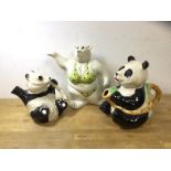 A group of three novelty china teapots including a Beswick teapot in the form of a panda, a panda