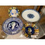 A Majolica footed plate with raised edge, portrait of lady to well, marked Faenza, below flower to