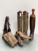 A pair of leather field boots with buckles, a pair of canvas and leather boots and wooden treds