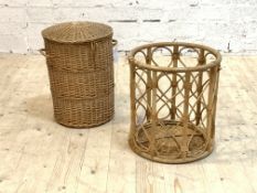 A cylindrical wicker lidded basket within an openwork bamboo stand (probably an associated