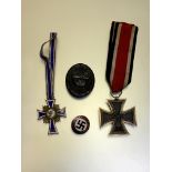 WWII German medals and badges to include Iron Cross 2nd Class Mother's Cross wound badge etc.