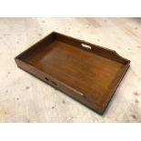 An early 20thc oak butlers tray with pierced handles to side (9cm x 71cm x 45cm)