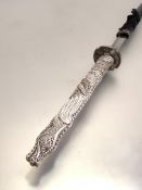 Samuri sword, a 20thc copy, the faux ivory handle in the form of a dragon, silvered metal tsuba with