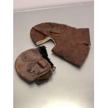 Two WWI period leather flying helmets, the smaller, leather with wool and fur lining (losses and