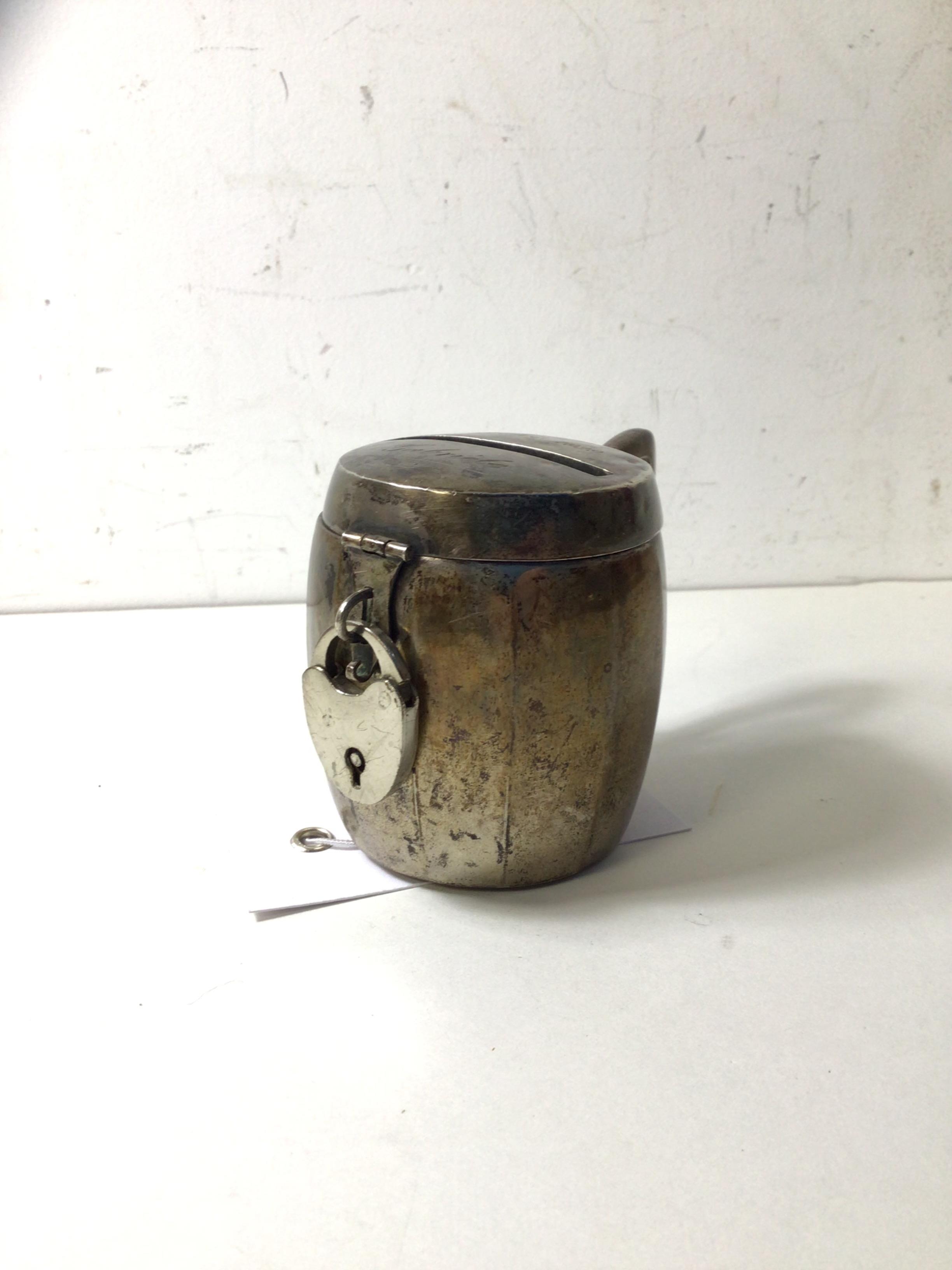 A continental coin bank in the form of a barrel with handle, top inscribed 21st November 1929,