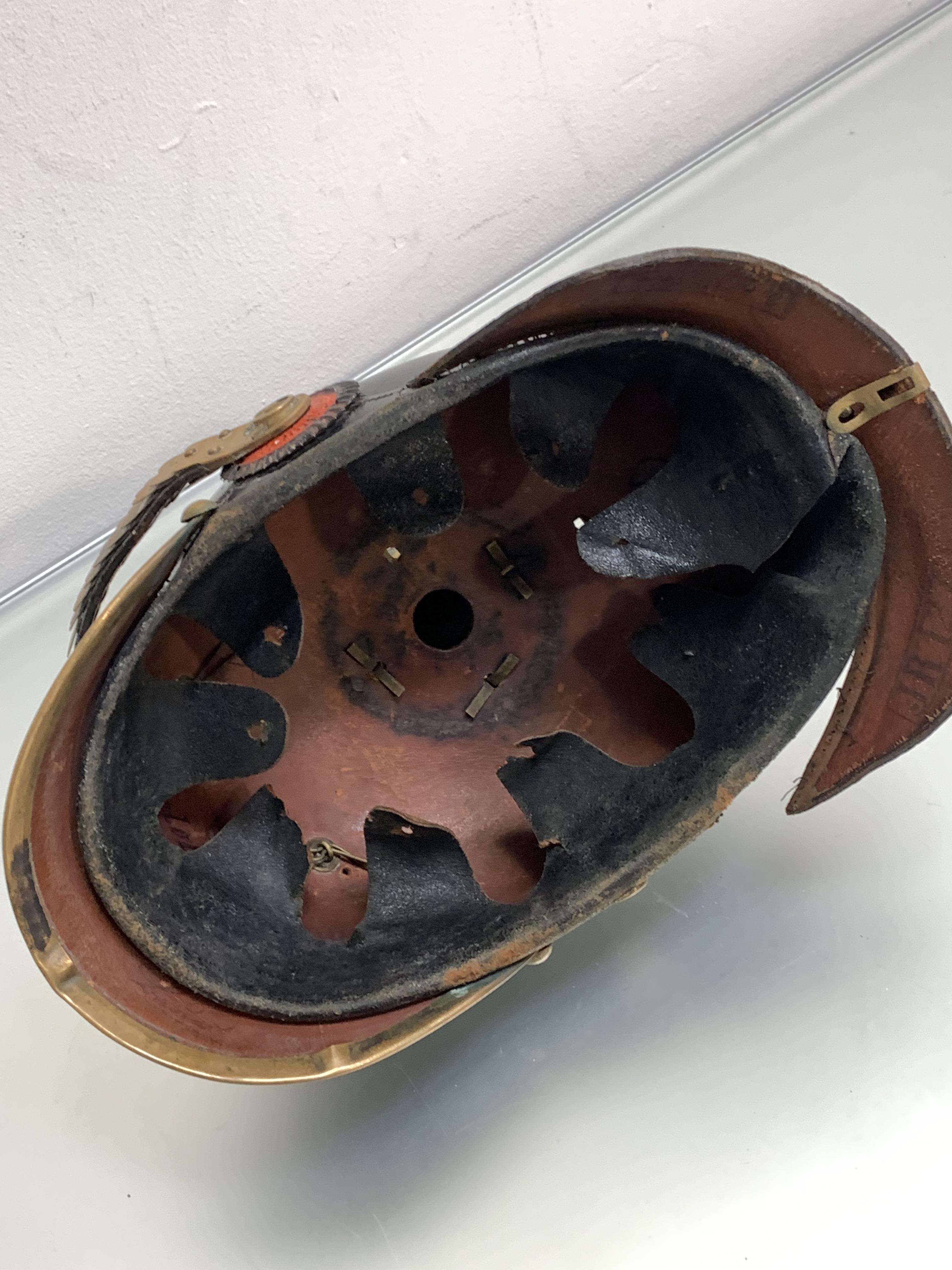 A WWI German Picklhaube black leather skull with brass fillings, one chinstrap and rosette - Image 2 of 2