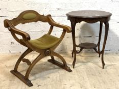 An Edwardian mahogany occasional table, the moulded top over leaf carved cabriole supports united by