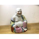 A laughing Buddha, (23cm h), no marks to base