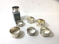 A collection of silver napkin rings, combined weight 182 grammes, an Elkington silver plated