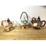 A group of three Japanese novelty china teapots all in the form of elephants with riders, (largest