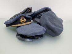 A Royal Air Force Air Vice Marshall's cap together with WWII period officer's cap, three ranks