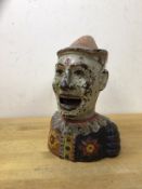 A Humpty Dumpty bank in the form of a polychrome clown, lacking arm, (20cm high)