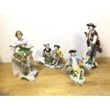 A group of four Dresden china figures including young woman with basket of fruit , a man with a