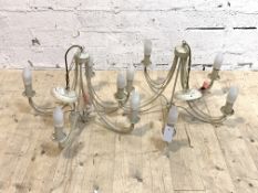 A pair of cream painted five branch chandeliers,