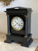 A Victorian slate mantel clock, of architectural form, with cast metal fluted pilasters enclosing