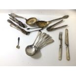 A pair of silver sugar nibs along with quantity of Epns including five soup spoons, a fruit knife