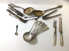 A pair of silver sugar nibs along with quantity of Epns including five soup spoons, a fruit knife