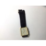 A Longines gentleman's wrist watch marked 9ct, with quartz movement on lizard strap