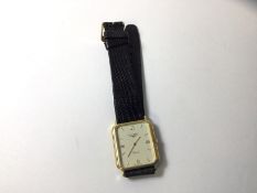 A Longines gentleman's wrist watch marked 9ct, with quartz movement on lizard strap