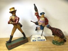 A group of alcohol mascot items including Johnny Walker, polychrome composition figure, (41cm h),