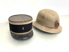 A WWII pith helmet with circular Welsh Guards cap badge (silvered), Failsworth Hats Ltd. 1942 61/8