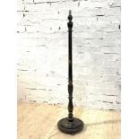 An early 20th century ebonised standard light, the turned column circular base with gilt chinoiserie