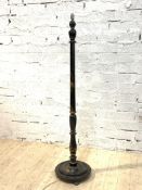 An early 20th century ebonised standard light, the turned column circular base with gilt chinoiserie