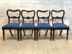 A set of four William IV mahogany mahogany dining chairs, with floral carved and scrolled rail