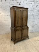 A Quality mahogany cocktail cabinet in the Georgian taste, the projecting cornice over two doors