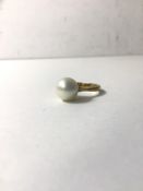 A gold ring with cultured pearl setting, ring marked 9ct, size J, weighs 2.95 grammes