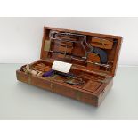 A 19thc mahogany cased surgeon's campaign set, the brass bound box with fitted interior housing