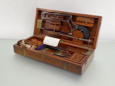 A 19thc mahogany cased surgeon's campaign set, the brass bound box with fitted interior housing