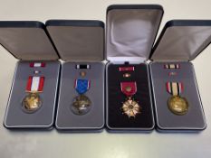 United States of America. Four cased medals including a Distinguished Flying Cross, Distinguished