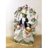 A 19thc Staffordshire flatback figural group, The Card Players, some losses (31cm x 20cm)