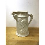 A late 19thc glazed stoneware pitcher depicting President Garfield to either side, spout supported