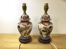 A pair of Japanese lidded vase style table lamps on wooden bases, (29cm to top of lampholder)